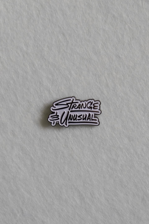 Strange and Unusual Enamel Pin