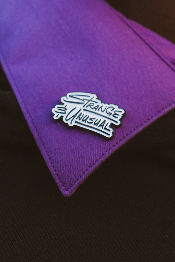 Strange and Unusual Enamel Pin