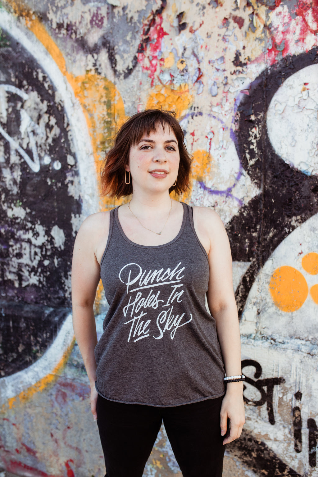 Punch Holes in the Sky Fitted Flowy Racerback Tank