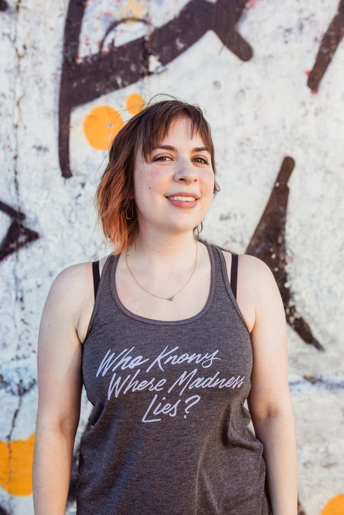 Where Madness Lies Fitted Flowy Racerback Tank | Don Quixote