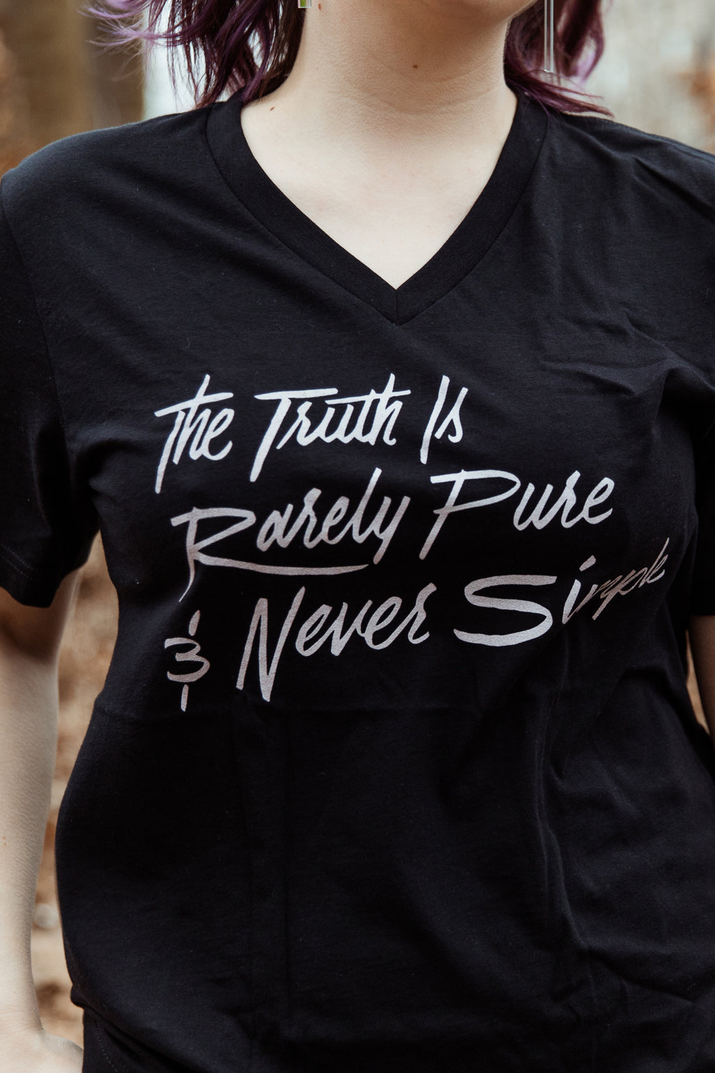 The Truth is Rarely Pure Unisex V-Neck T-Shirt